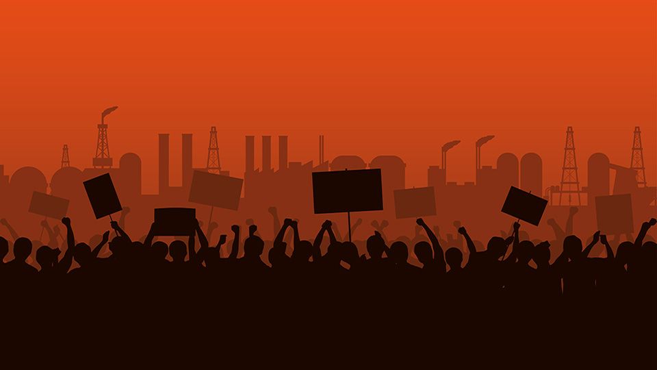 Silhouette group of people Raised Fist and Protest Signs at evening with factory Industrial Estate and orange color sky background