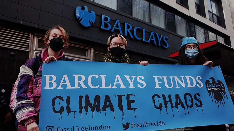 Fossil Free London protestors outside a branch of Barclays bank