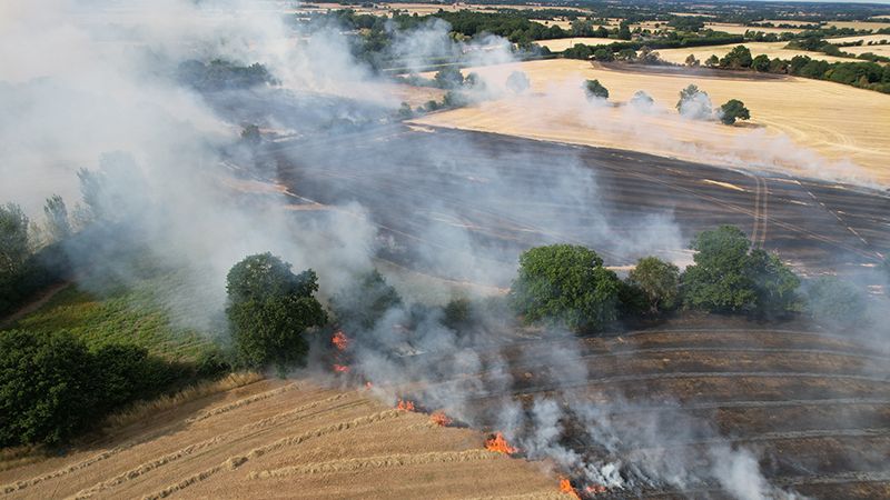 Huge Wildfires in farm fields Essex Ongar drone aerial view