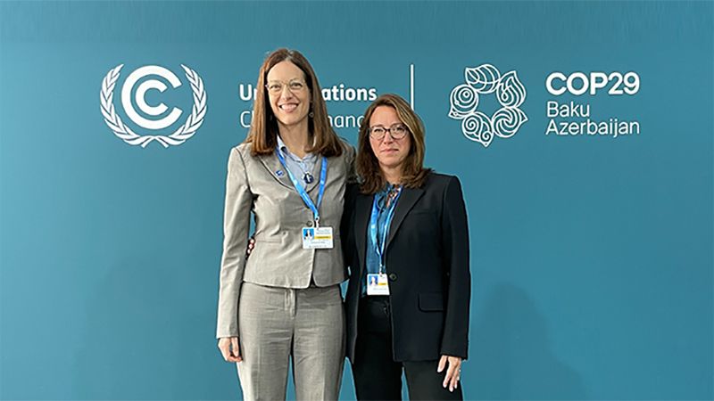 Cristina Gil White (left) and Sherry Medura (right) meet at COP29 in Baku