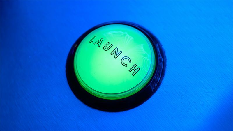 A bright green button with the word Launch on it in black letters with a blue background