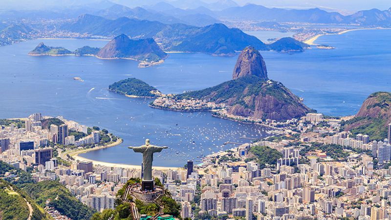 Aerial view of the Christ, The Redeemer Monument and the Corcovado Mountain in Rio de Janeiro, Brazil. One of the Seven Wonders of the World the monument is a must-go spot do travelers upon visiting Rio. Along with the beautiful statue the view of the Corcovado is breathtaking with the Sugarloaf Mountain and the Botafogo Bay among some of the places you can see from up there.