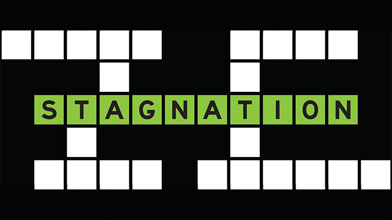 Alphabet letter in word stagnation on crossword puzzle background